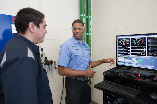 Professor Andrew McGee trains a student.