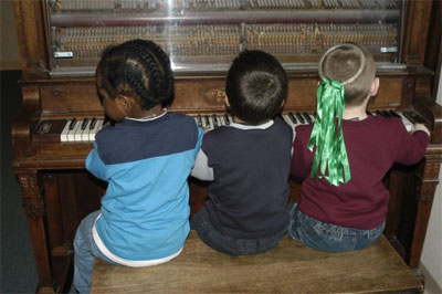 Kids on piano at SCC Childrens Center
