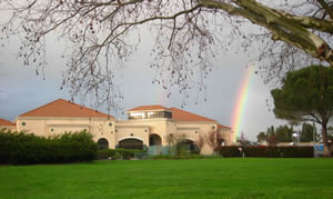 Photo of the Childrens with Rainbow in Background' Center Building