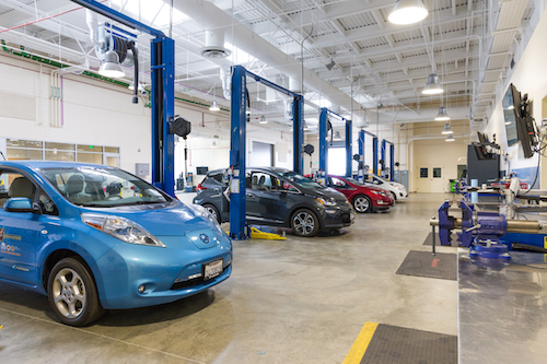 Automotive technician classroom with cars and equipment