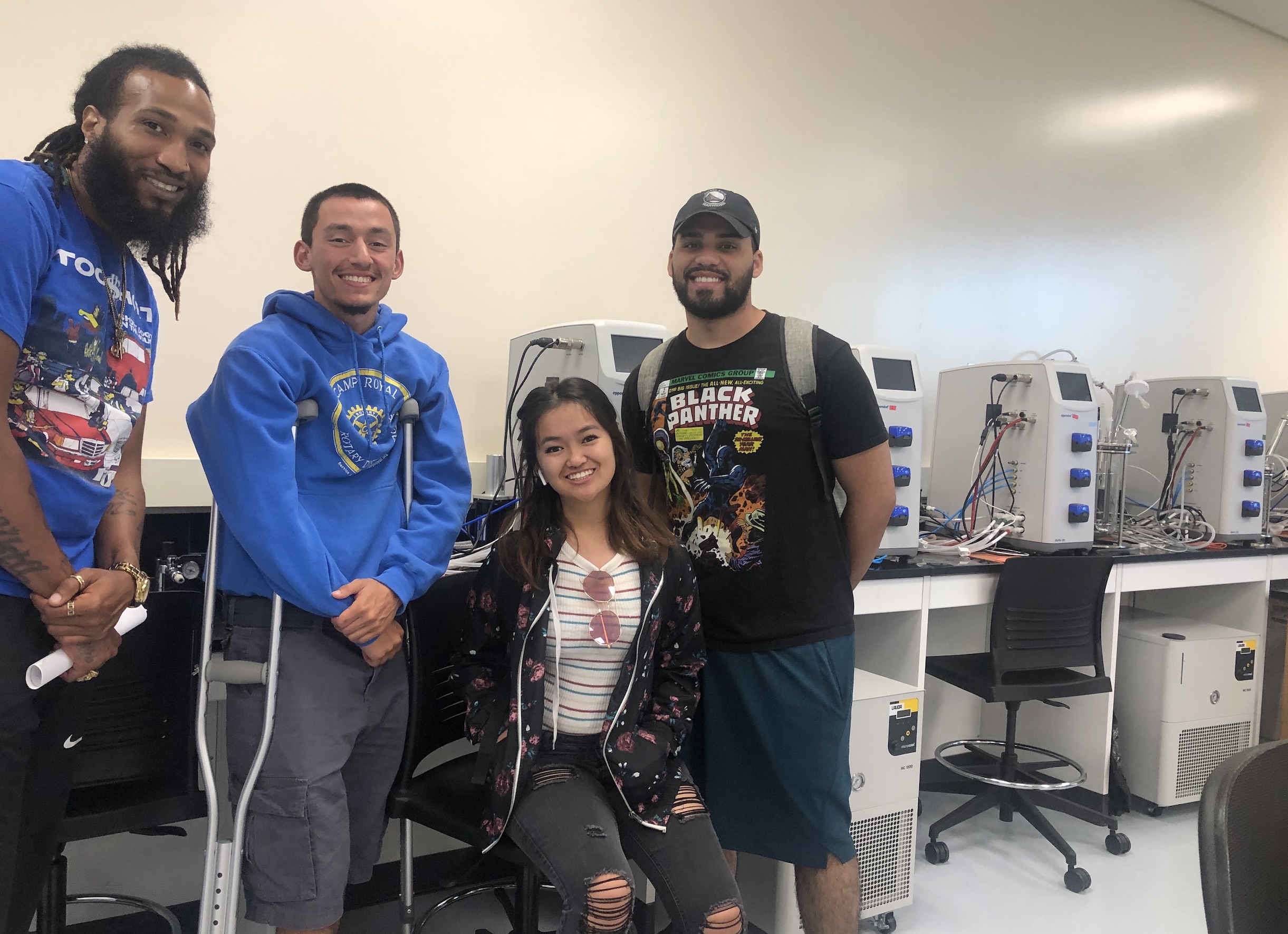 Student ambassadors and summer bridge students pose in the bio tech vavaville facility